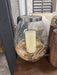 Candle holder with wood chips