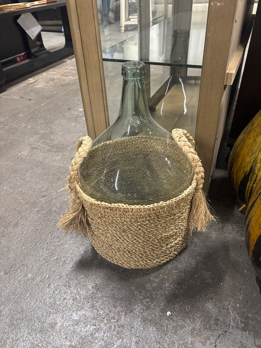 Glass pot in basket