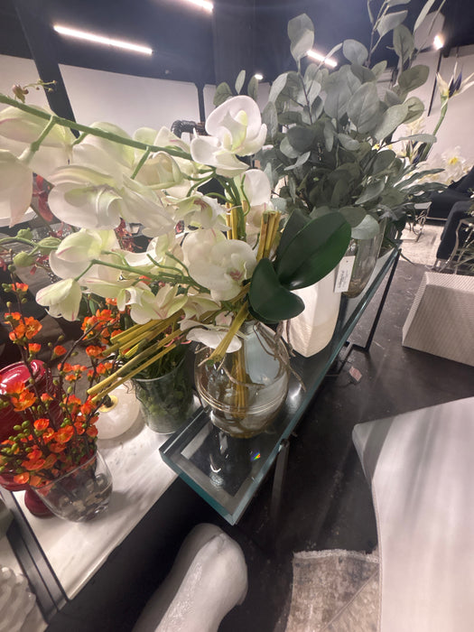 Orchids with glass vase